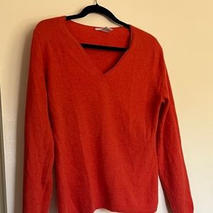 Cashmere rusty orange v neck pullover. Its used, slight signs of wear. Soft